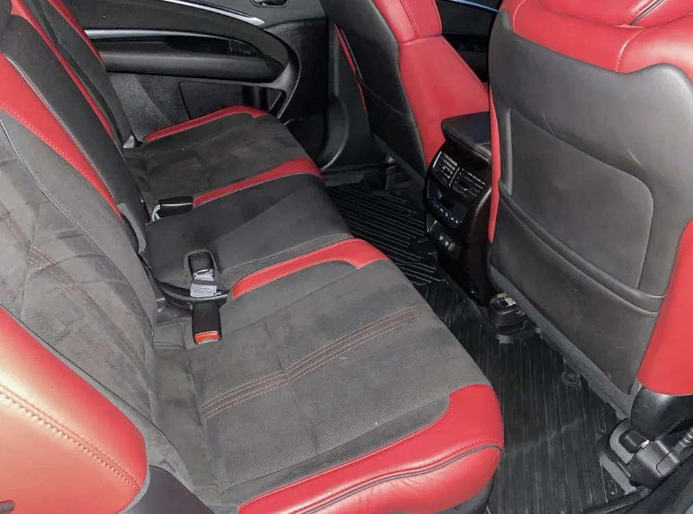 Red and black leather rear seats after detailing, clean and restored